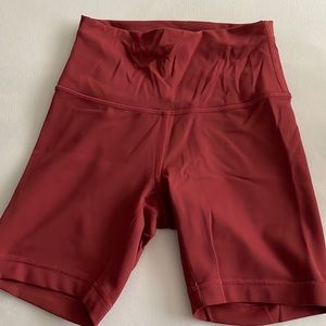 LULULEMON red biker shorts with string inside to make tighter size 4